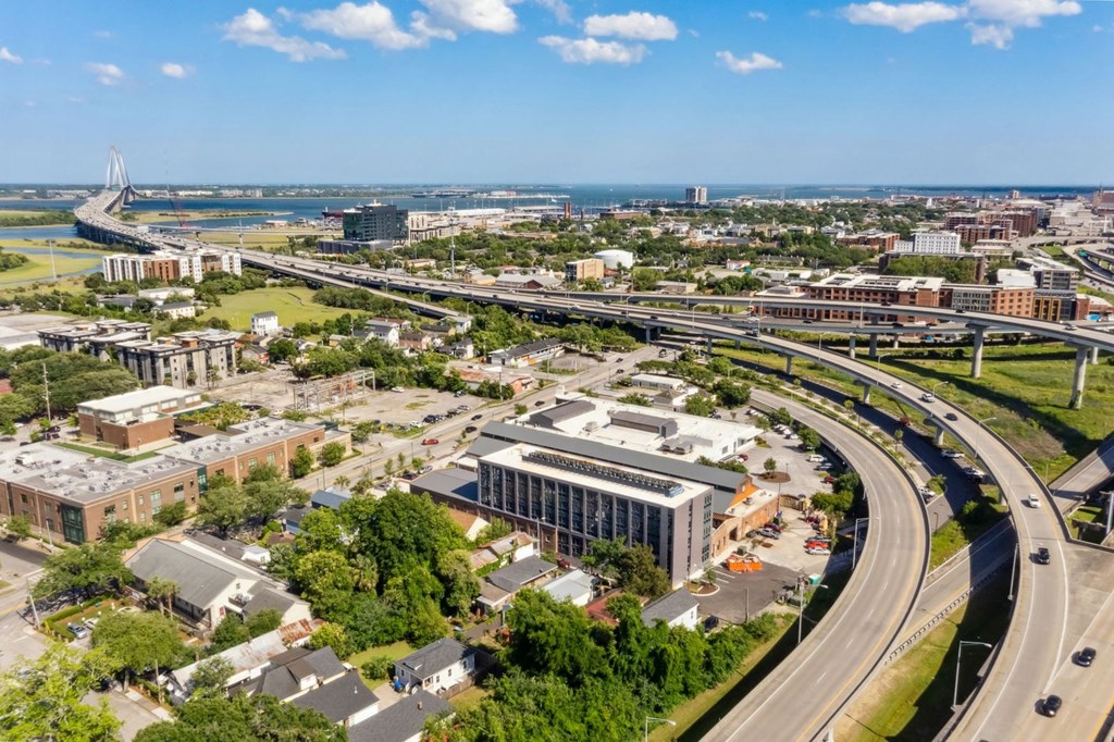 an aerial view of a city with highways and buildings