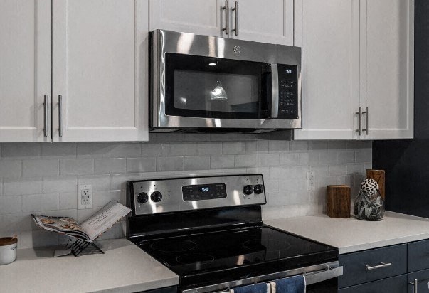 a kitchen with a stove and a microwave