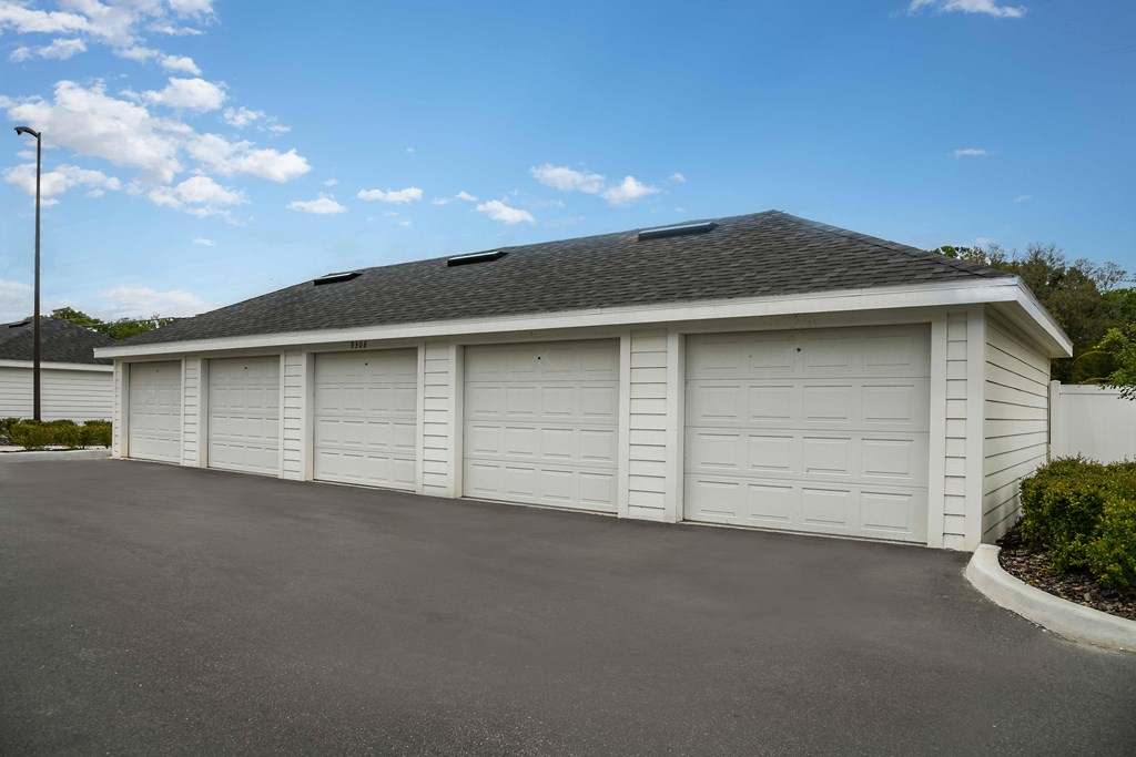A two-car garage with a grey roof and white walls.