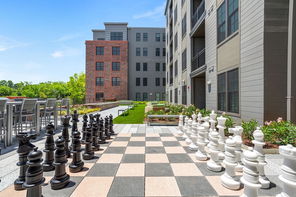 a giant chess board in the courtyard of a building