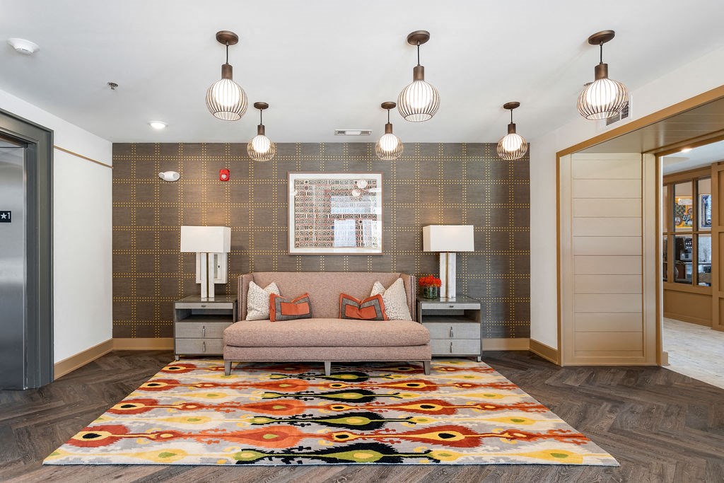 a living room with a couch and lamps