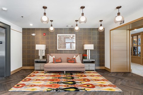 a living room with a couch and lamps