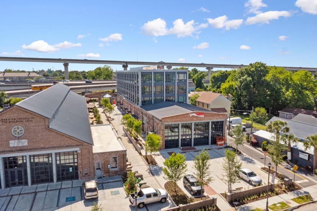 an aerial view of a city with buildings and a bridge