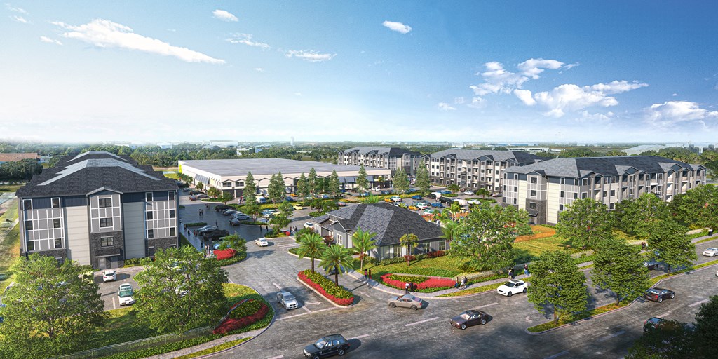 A large, modern building complex with a parking lot in front.