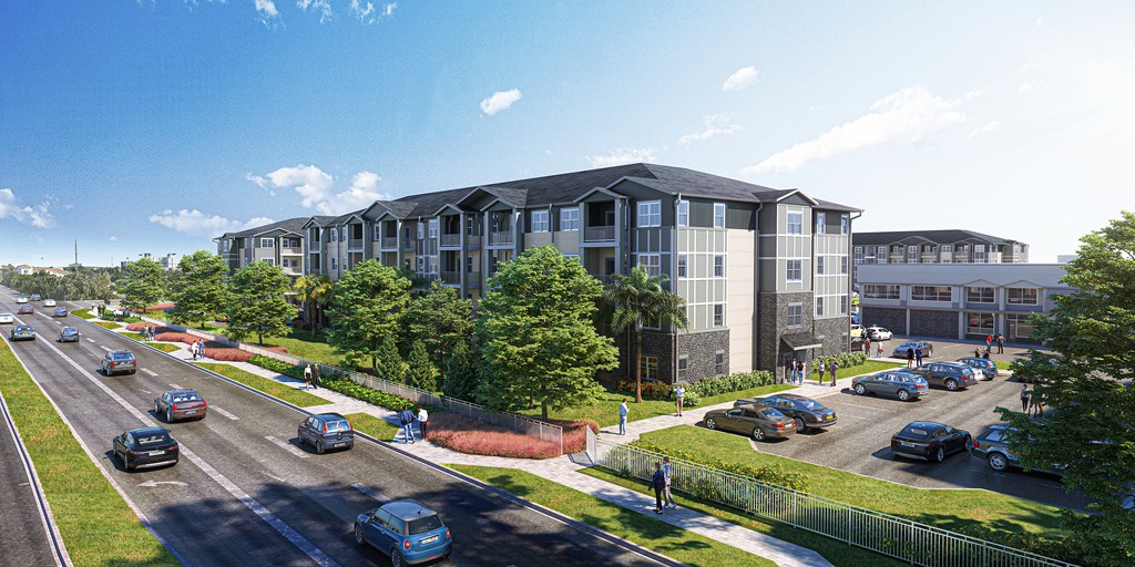 A street view of a multi-story building with cars parked in front.
