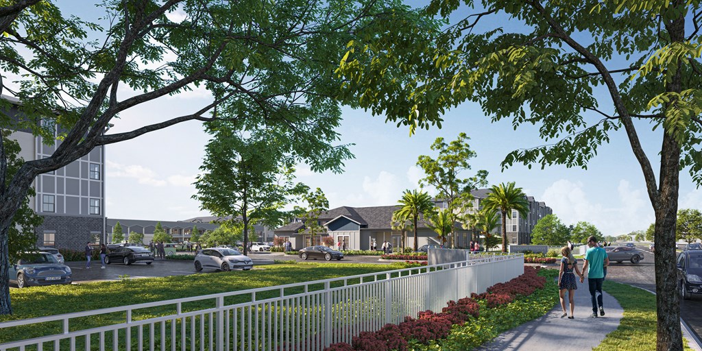 A couple walking down a tree-lined street in a residential area.