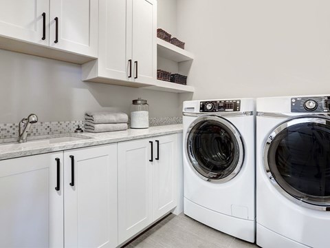 A laundry room with a washer and dryer.