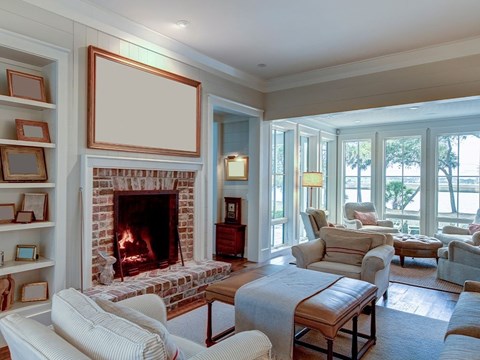 A living room with a fireplace and a couch.