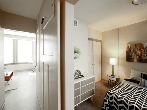 a bedroom with a bed and a closet