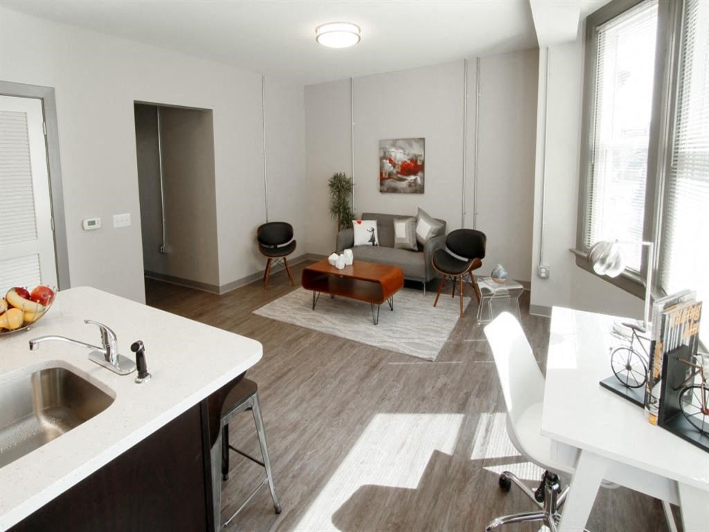 a living room and kitchen in a small apartment