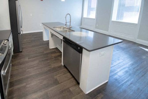 a kitchen with a counter top and a sink