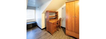 an empty room with a desk and a chair
