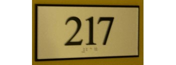a white sign with the number 27 on it