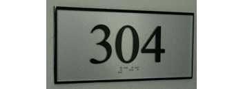 a white sign with the numbers 310 on it