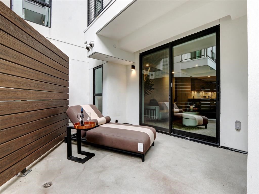a bedroom with a bed next to a sliding glass door