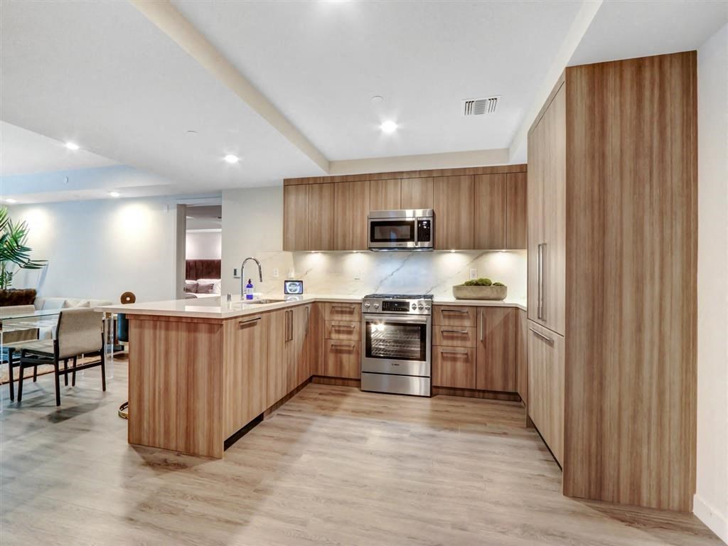 a kitchen with wooden cabinets and a counter top