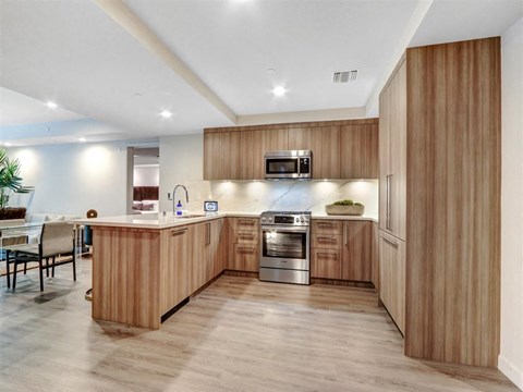 a kitchen with wooden cabinets and a counter top