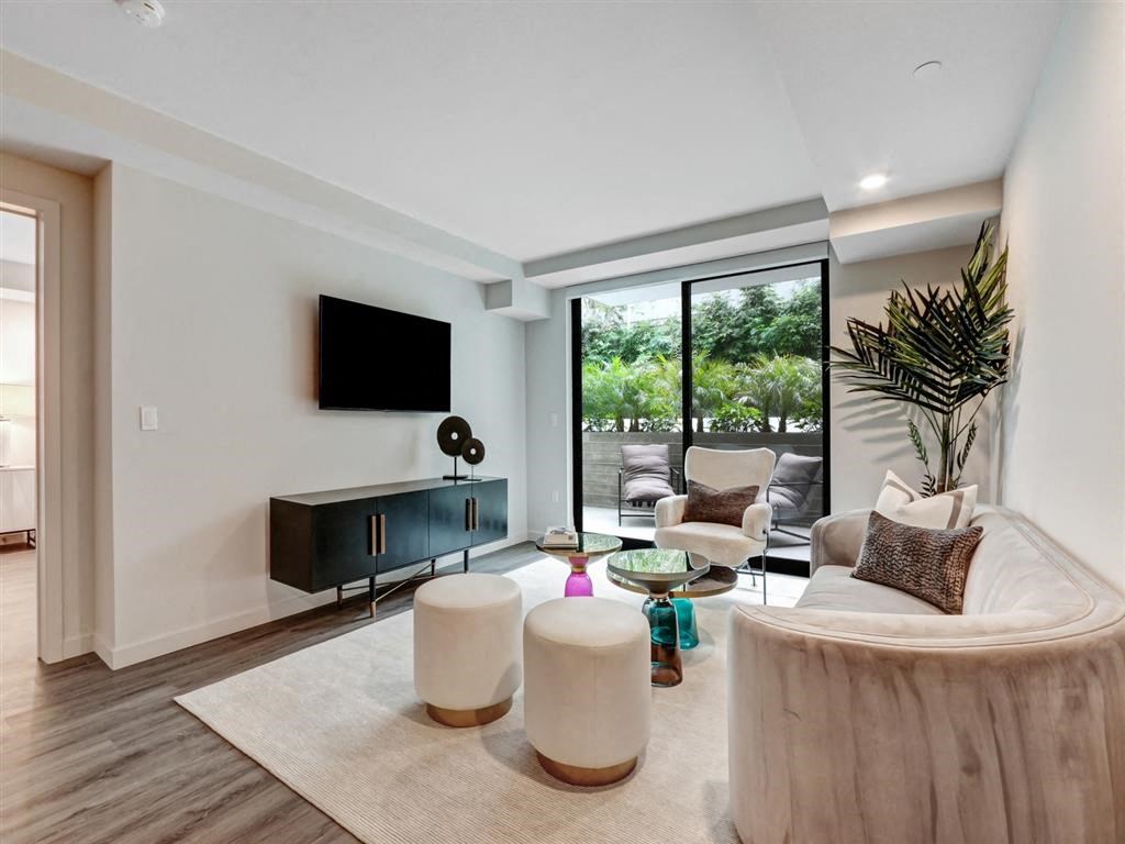 a living room with a couch and a tv