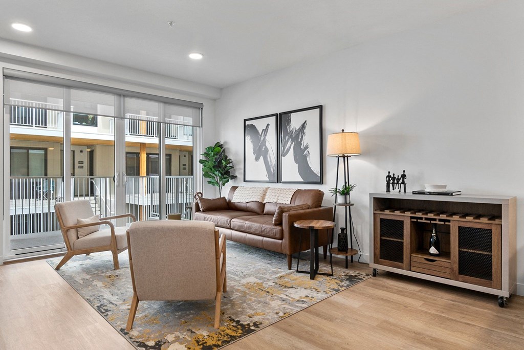 a living room with a couch chairs and a fireplace