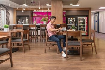 a man sitting at a table in a restaurant