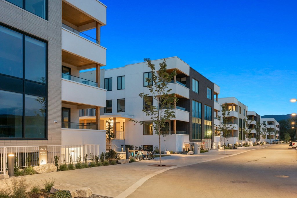a row of modern apartment buildings on a city street