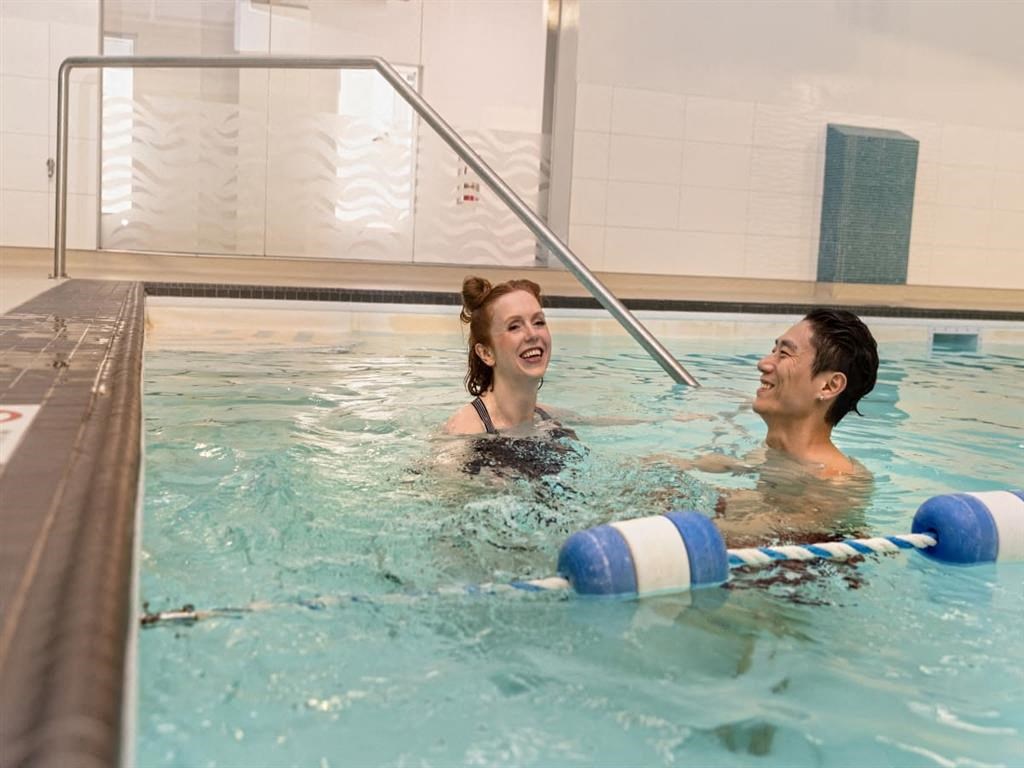 a man and a woman in a swimming pool