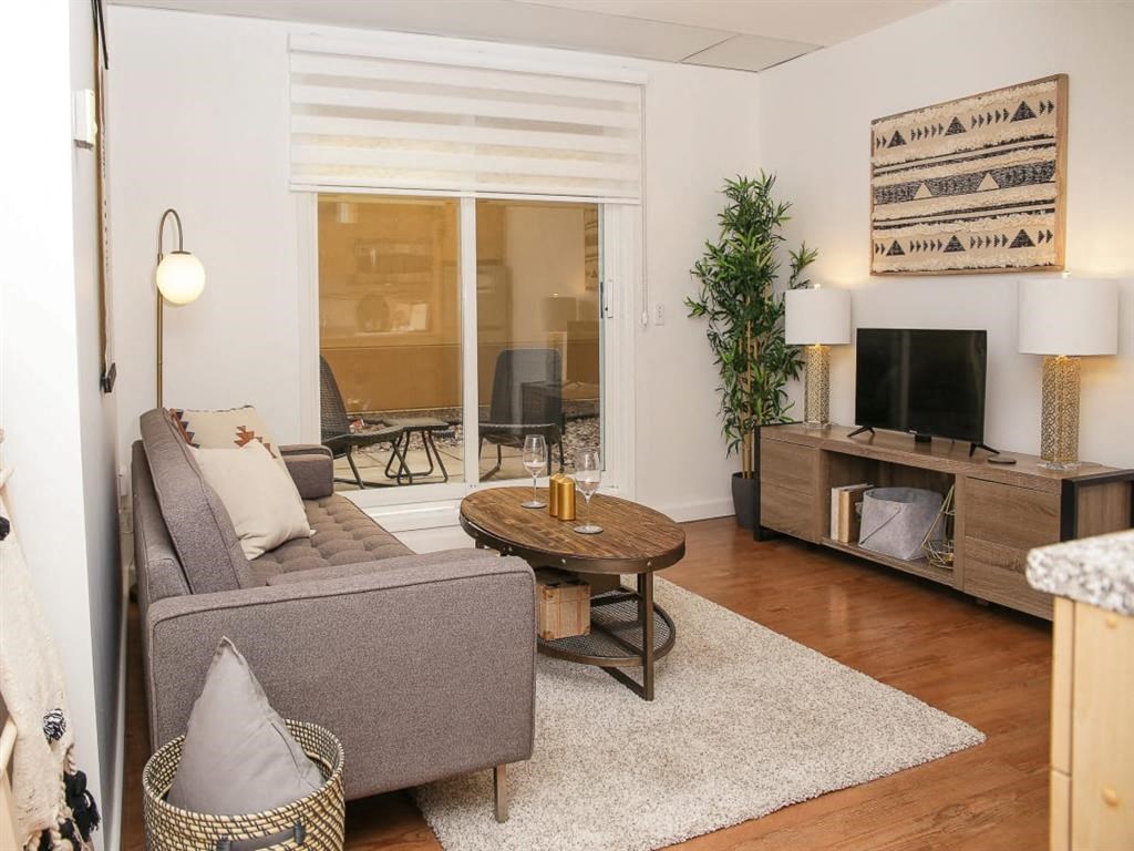 a living room with a couch and a television