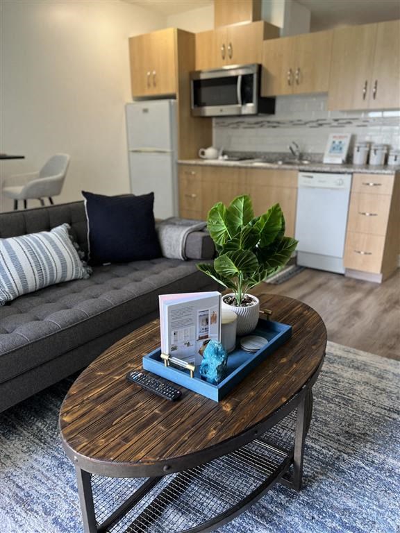 a living room with a table and a couch