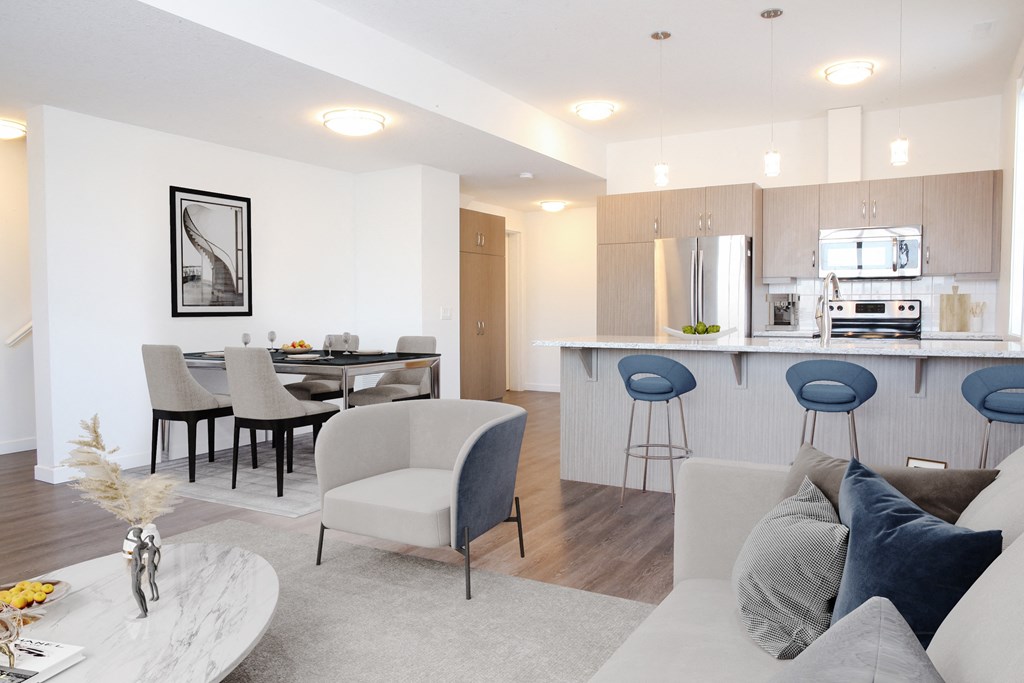 a living room with a kitchen and a dining room