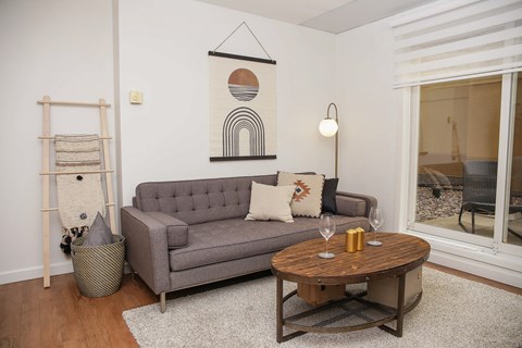 a living room with a couch and a round table