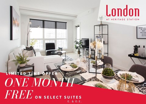 A living room with a dining table set up and a sign that says "One Month Free on Select Suites".
