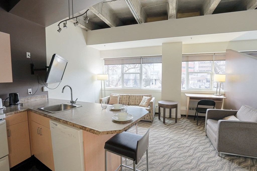 a kitchen and living room in an apartment
