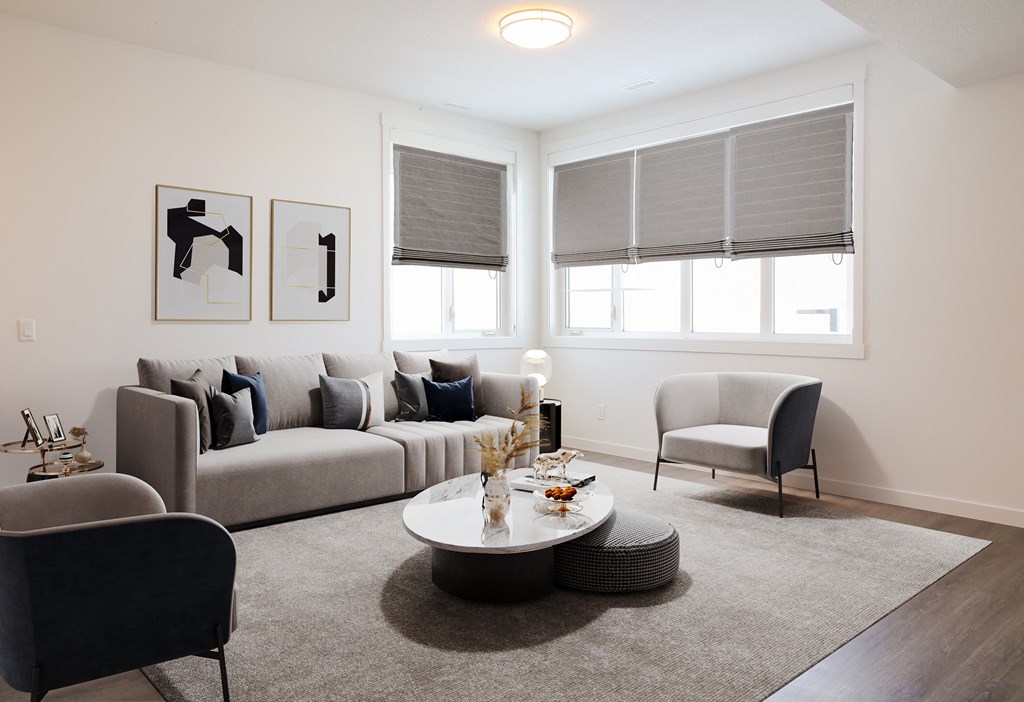 a living room with couches and chairs and a coffee table