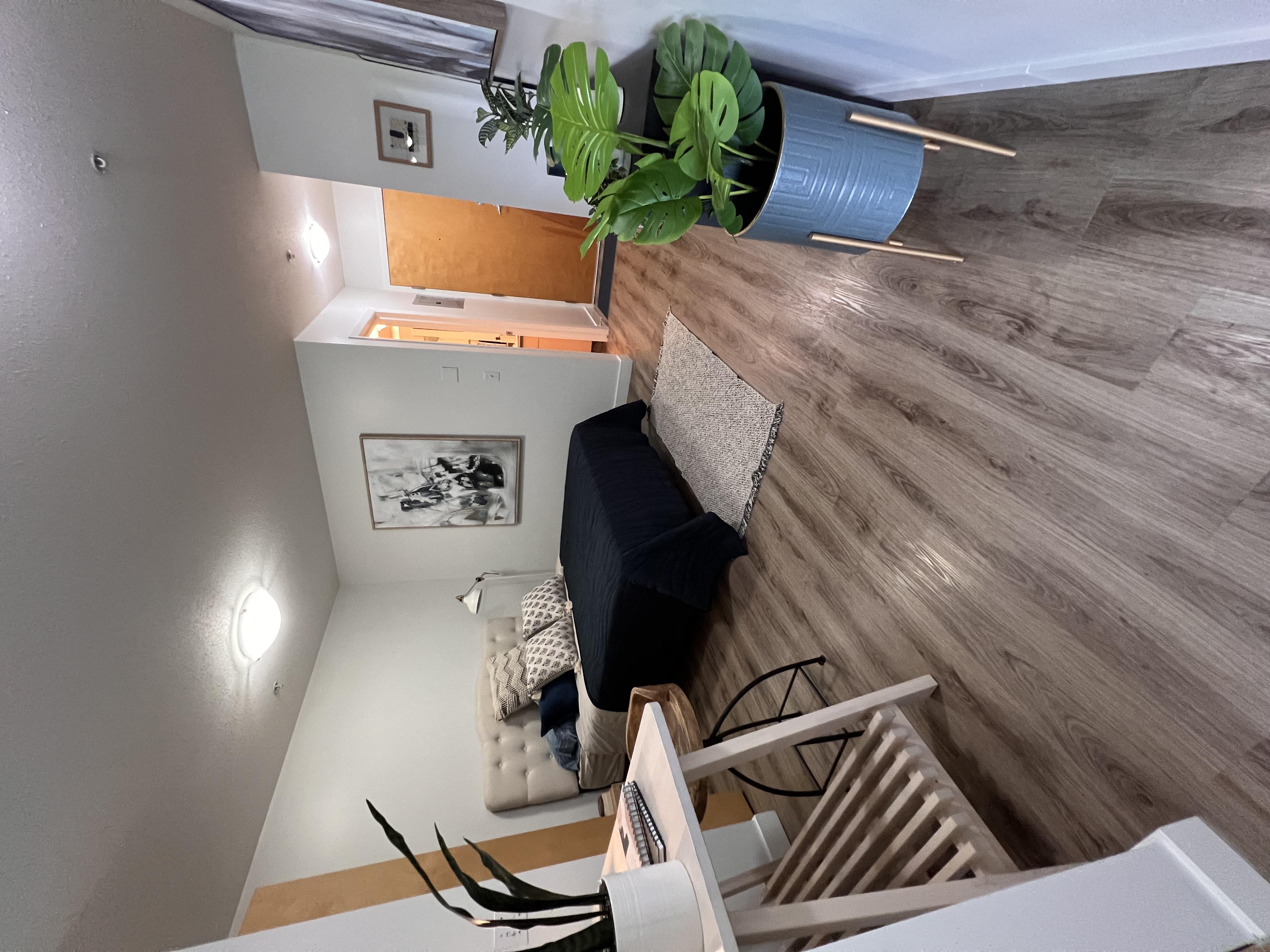 a view of the living room from the loft