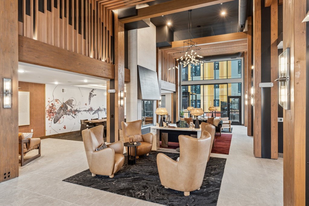 A modern living room with a large table and chairs.