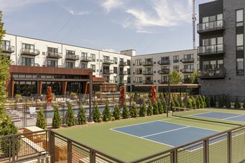 a view of the tennis courts on the roof of a building