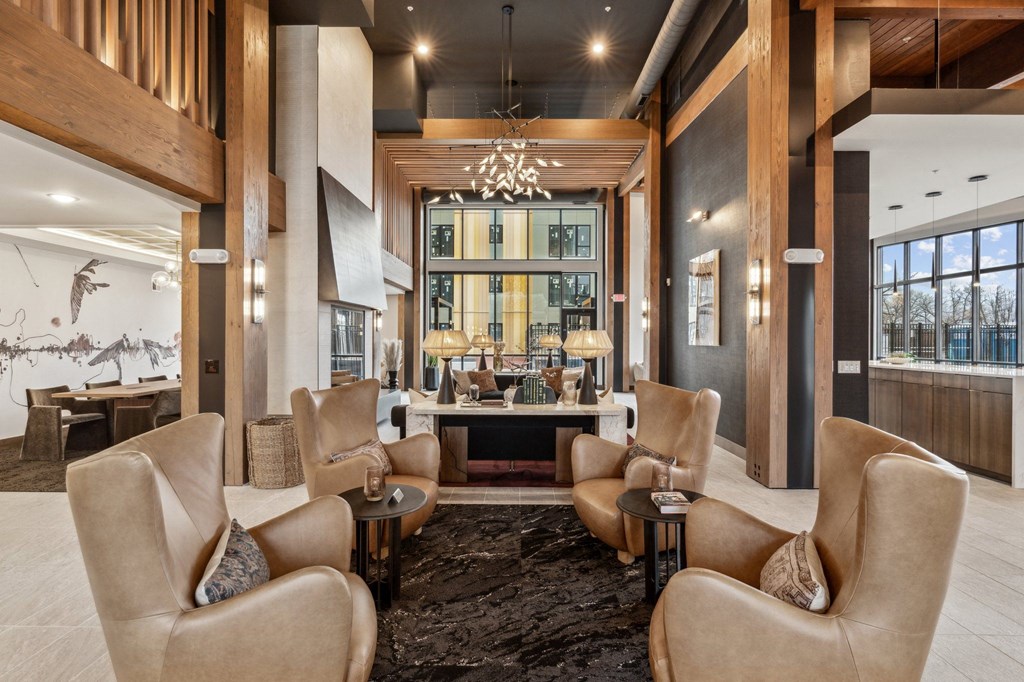 A large room with a long table and chairs.