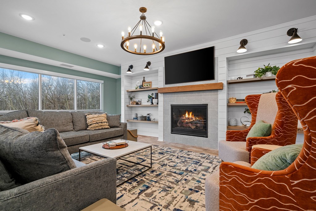 a living room with a fireplace and a television