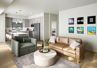 a living room with a leather couch and chair and a round coffee table in the middle of