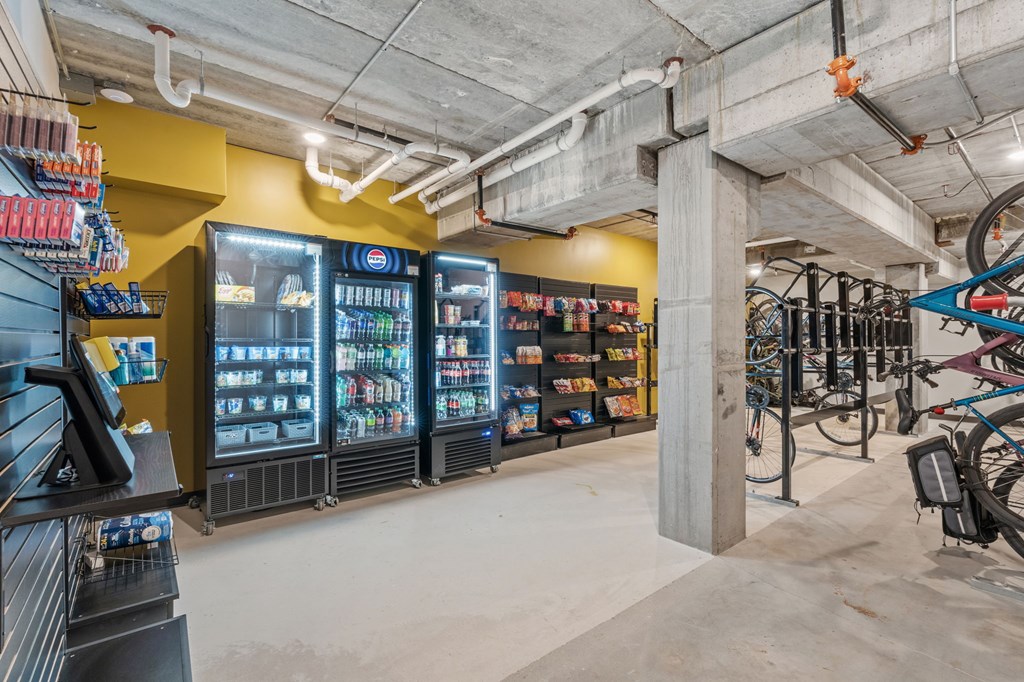 A bike shop with a yellow wall and a white ceiling.
