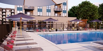 Exterior pool and poolside lounge at The Isaac Apartments - Photo Gallery 3