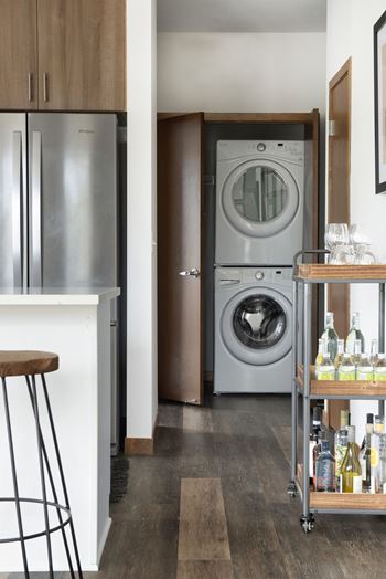 a small kitchen with a washing machine in it