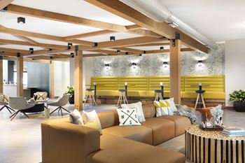 a living room with couches and chairs and a table