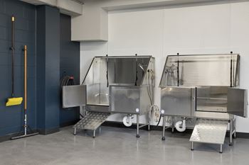 a commercial kitchen with stainless steel units and stainless steel benches
