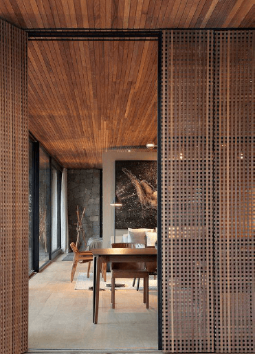 a conference room with a wooden ceiling and a table and chairs
