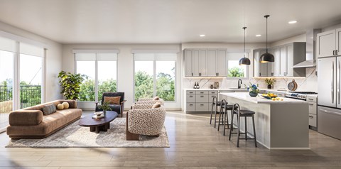 A modern kitchen with a large island and bar stools.