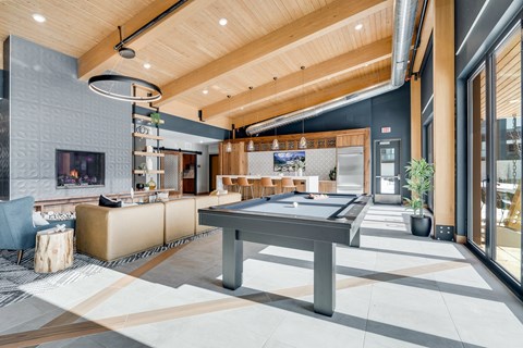 a pool table in the center of a living room