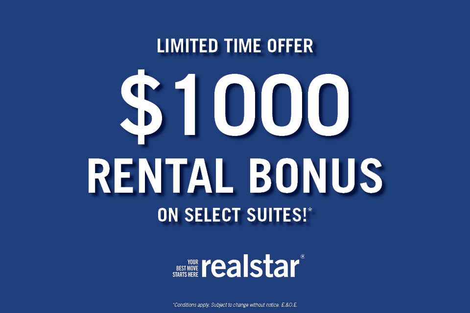 A blue advertisement for a $1000 rental bonus on select suites from Realstar.