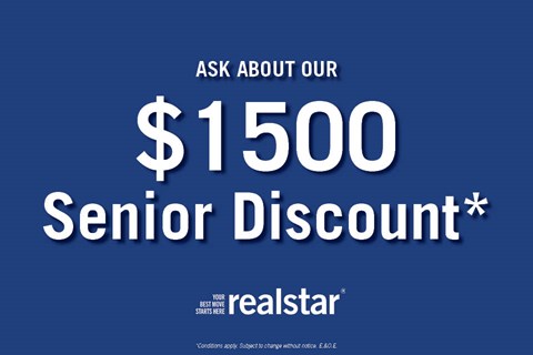 A blue advertisement for a $1500 senior discount from Realstar.