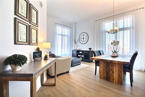 La Voile Boisbriand living area featuring large floor to ceiling windows in Boisbriand, QC